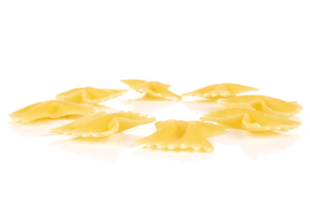 istock Yellow farfalle pasta isolated on white 1209529168