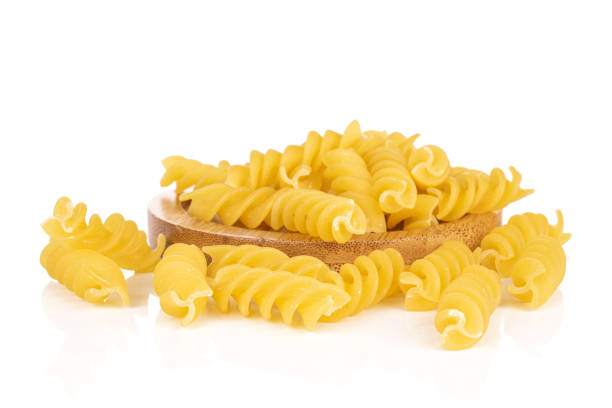 istock Yellow fusilli pasta isolated on white 1209529530