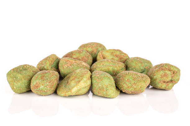 istock Green wasabi peanut isolated on white 1209537419