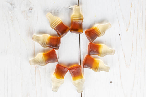 istock Sweet jelly cola on grey wood 1209539160