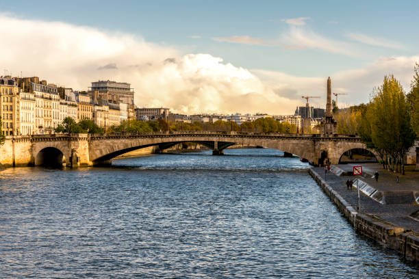 A view to Pont de la Tournelle bridge and Seine river in Paris city centre stock photo
