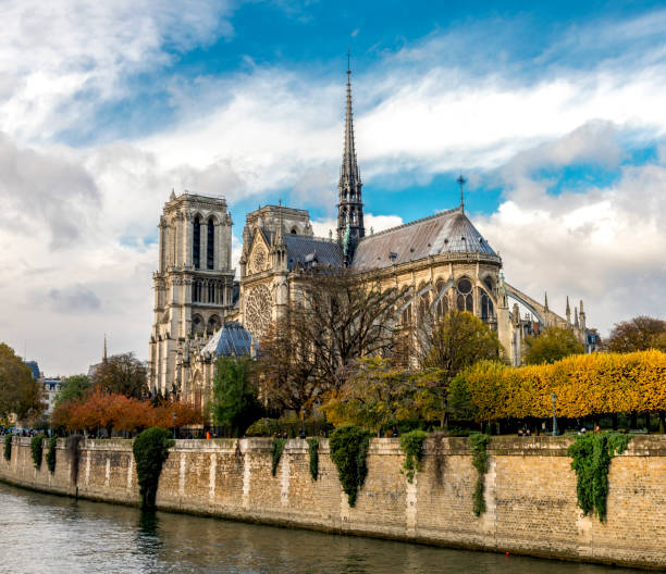 istock Beautiful Notre-Dame de Paris cathedral with a Gothic spire several month before the fire in colorful autumn season, Paris 1209542388