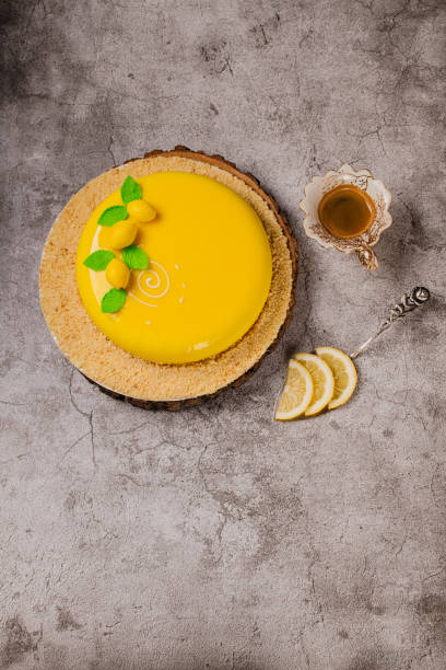 Lemon mousse cake and a cup of coffee with lemon