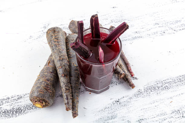 Drink turnip juice (Salgam). Red carrot and turnip juice on a white wooden background. Traditional turkish drink turnip juice (Salgam). Red carrot and turnip juice on a white wooden background. turnip stock pictures, royalty-free photos & images