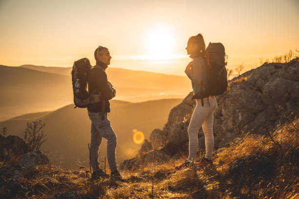 istock Two hikenrs on mountain on sunny day 1209549814