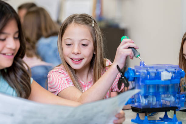 istock Two female students working together on STEM project together in science class 1209551651