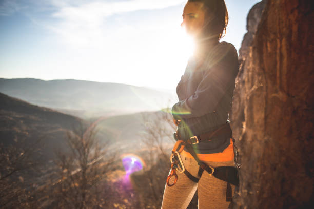 Female hiker preparing for rappelling