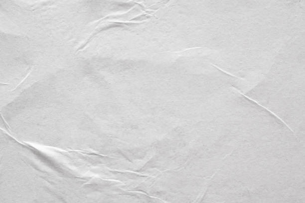 istock Blank white crumpled and creased paper poster texture background 1209553724