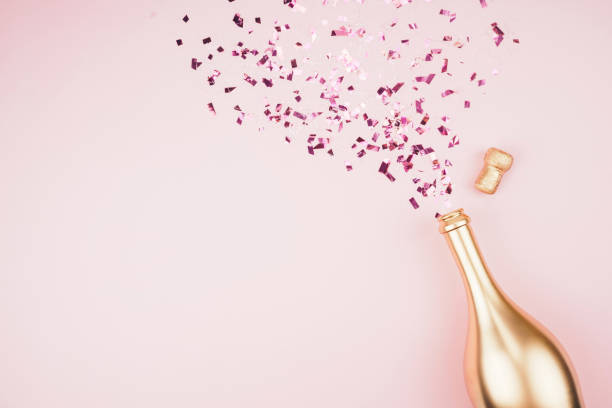 istock Bottle of champagne and confetti. 1209553870