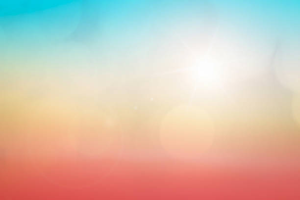 istock Natural background blurring warm colors and bright sun light. Bokeh or Christmas background Green Energy at sky sunny color orange light patterns plain abstract flare evening clouds blur. 1209553972