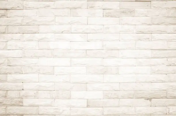 Photo of Cream and white wall texture background, brick stone pattern modern decor home and vintage stonework floor interior or design concrete old brickwork stack limestone seamless nature for copy space.