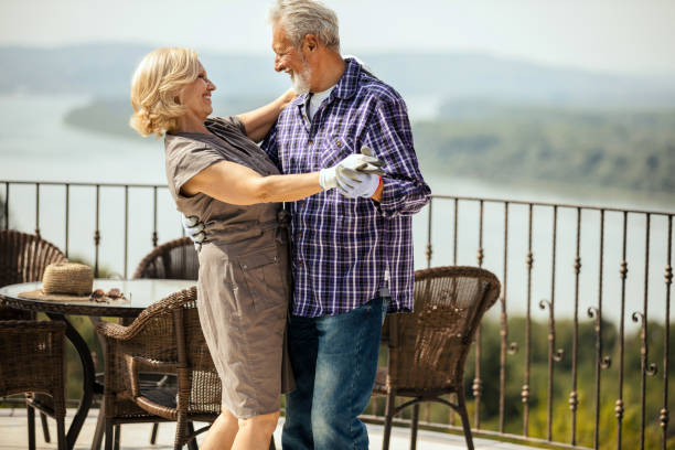 istock Senior couple dancing in their backyard, close up 1209554046