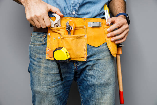 istock Man with set of hand tools stock photo 1209554216