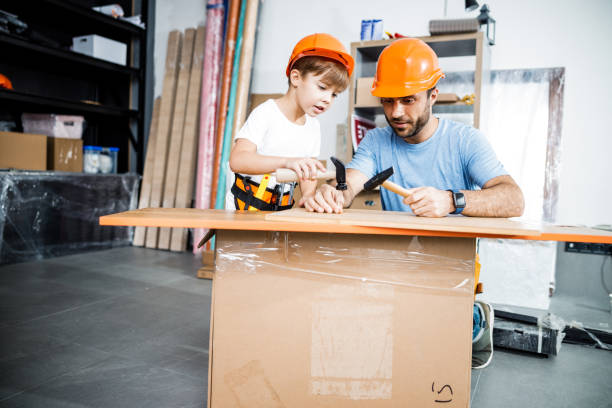istock Father with son together in workshop stock photo 1209554761