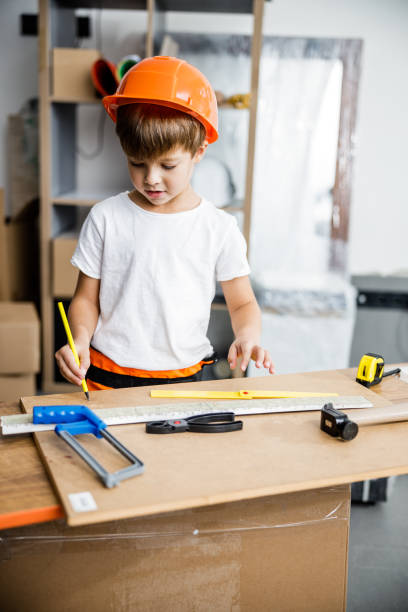 istock Little boy doing drawings in workshop stock photo 1209555308