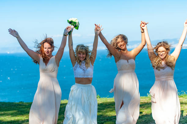 istock Cheerful Bride Cheering with Bridesmaids - stock photo 1209555734