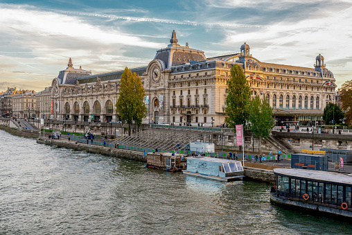 A magnificent city view of Musee d'Orsay museum and Seine river embankment, Paris, France, autumn season, November 2017