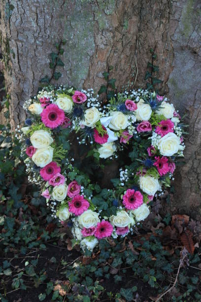 istock Heart shaped sympathy flowers 1209567731