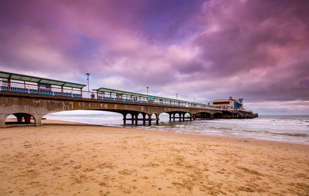 istock Bournemouth pier illuminated by the setting sun at sunset 1209576157