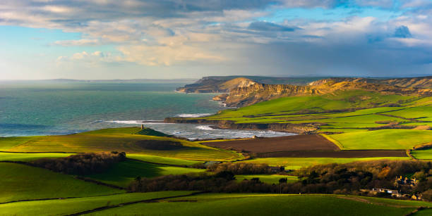 Kimmeridge and the Dorset Coastline from Swyre Head Swyre Head is the highest point in the Purbeck Hills and the 360 degree views are breathtaking - absolutely worth the 682ft climb jurassic coast world heritage site stock pictures, royalty-free photos & images