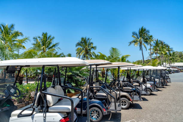 Golfcar on beautiful golf course in the evening golf course with fresh green grass field and cloud sky.