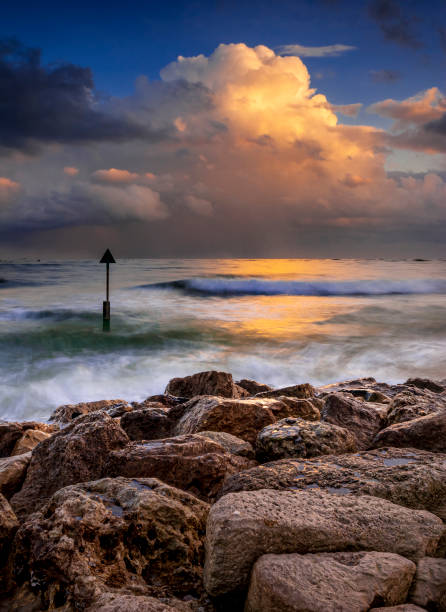 istock Storm clouds illuminated by the sunset approach Sanbanks Beach 1209581043