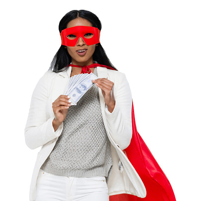 One person of aged 20-29 years old who is beautiful with black hair latin american and hispanic ethnicity female business person in front of white background wearing costume who is conquering adversity and holding currency