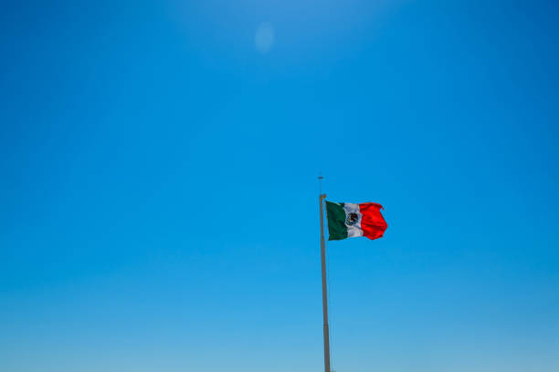 istock Giant mexican flag flies in the wind in Cancun 1209583344