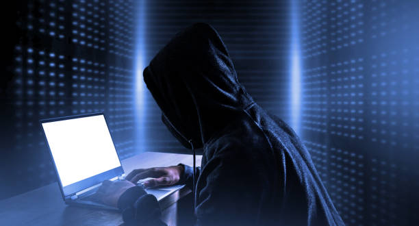 istock Cybercrime, hacking and technology crime. hacker with laptop. 1209584120