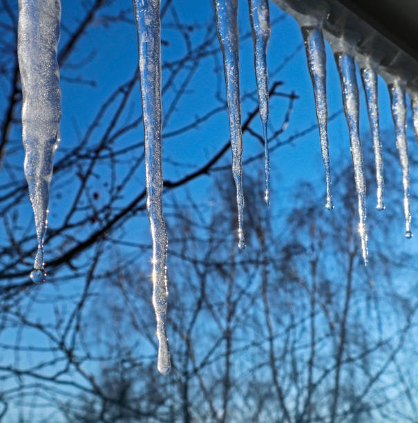 istock Icicles against the blue sky. 1209585842