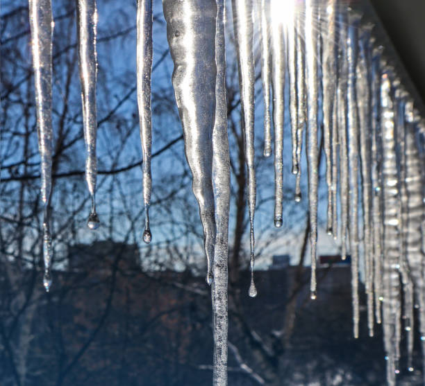 istock Icicles against the blue sky. 1209585864