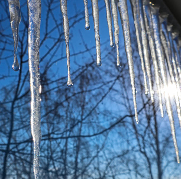 istock Icicles against the blue sky. 1209585870
