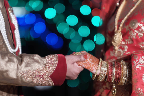 istock indian couple holding hand at wedding day 1209587065
