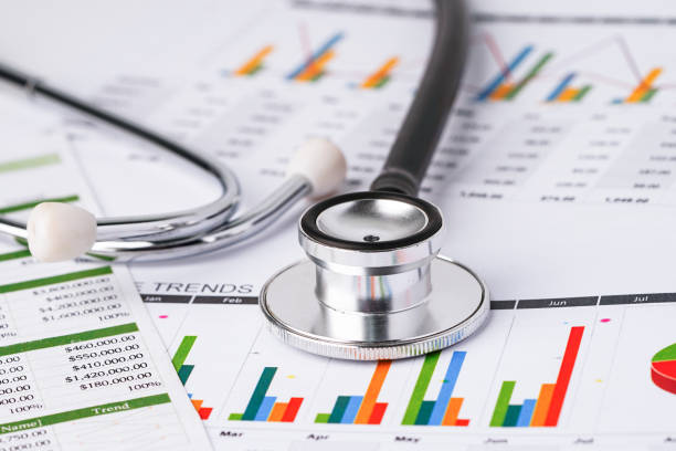 istock Stethoscope on chart graph paper : finance, account, statistic, analytic economy Business concept. 1209589783