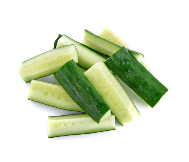 istock Fresh japanese cucumber sliced isolated on white 1209589862