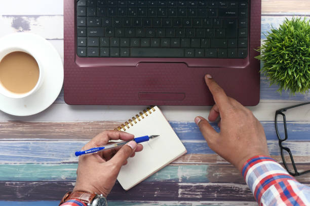 istock high angle view of businessman man using laptop 1209589954