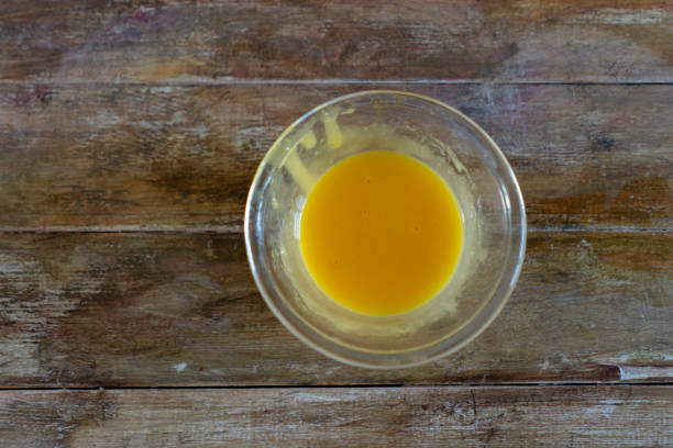 istock egg yolk in glass bowl on wooden table 1209592305