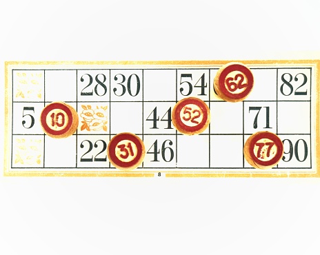 Wooden lotto barrels with numbers, bingo game. Board family game. Isolated on white background.