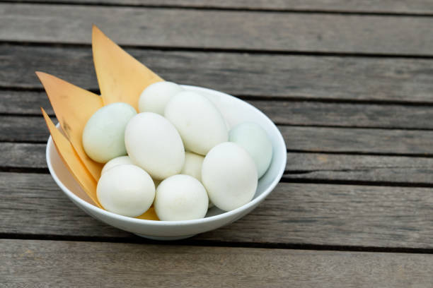 istock Duck eggs in white bowl on wooden 1209595018