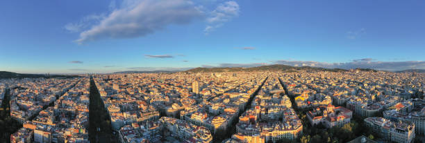 istock panorama Drone aerial view of famous straight down view, Eixample streets and old tradition buildings and street trafic, beautiful famous urban grid pattern in Spain. 1209595644
