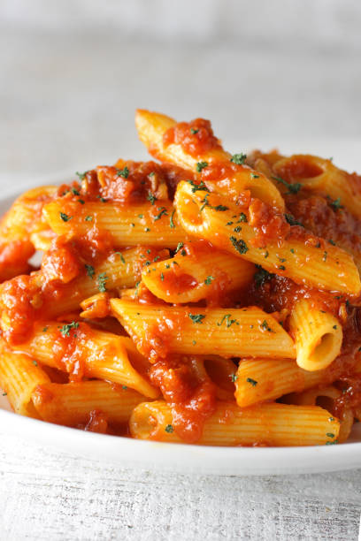 istock Short pasta penne bolognese sauce 1209595949