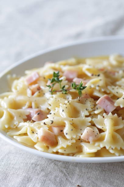 Farfarre, short pasta, bacon, cheese, pepper, black pepper, carbonara sauce, linen, linen background,