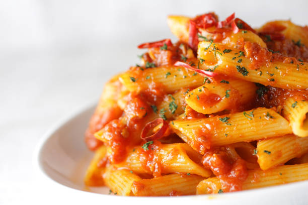 istock Short pasta penne bolognese sauce 1209596444