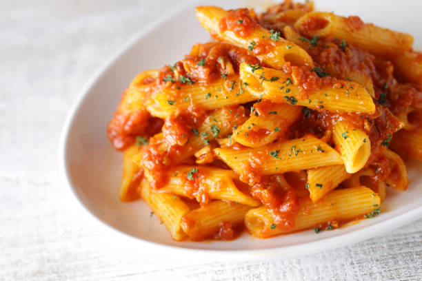 istock Short pasta penne bolognese sauce 1209596502