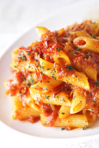 istock Short pasta penne bolognese sauce 1209596513
