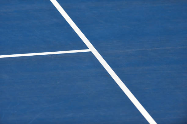 istock White lines on blue tennis court 1209602459