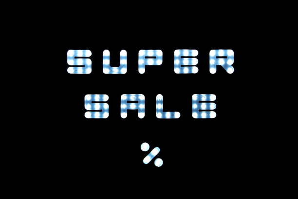 istock LED lights with the word Super Sale % on black scoreboard background 1209606563