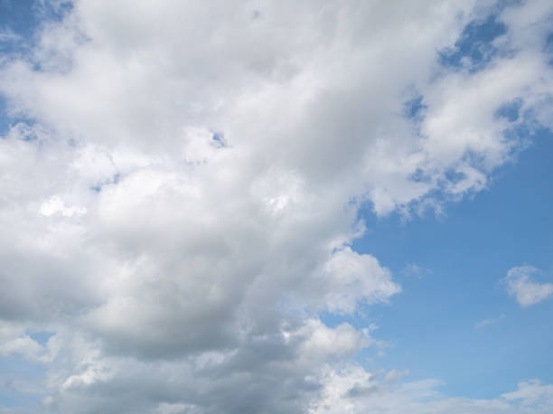 istock white cloud on blue sky background in the sunny day 1209608105