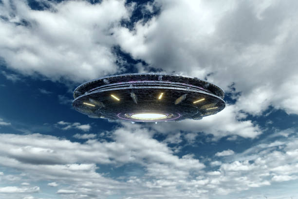 istock UFO, an alien plate soars in the sky, hovering motionless in the air. Unidentified flying object, alien invasion, extraterrestrial life, space travel, humanoid spaceship. mixed medium 1209611762