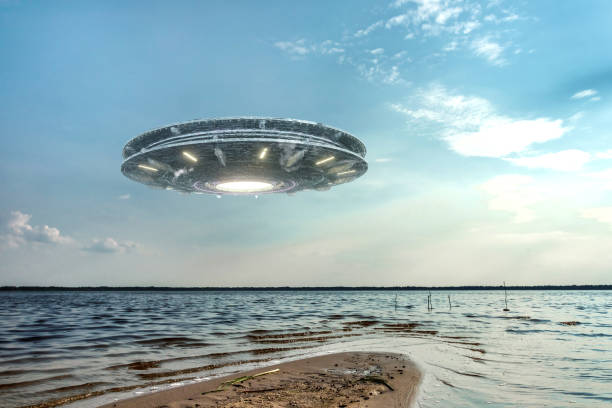 istock UFO, an alien plate hovering above water, hovering motionless in the air. Unidentified flying object, alien invasion, extraterrestrial life, space travel, humanoid spaceship. mixed medium 1209611785